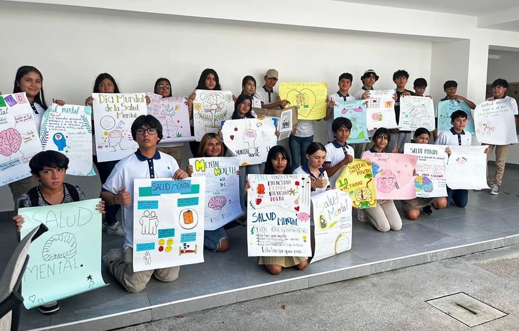 PEACE Punta de Mita students holding their artwork